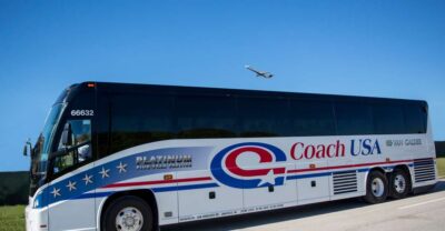 Travel between Chicago O'Hare and Madison - Inside the Bus: Reclining Seats, Climate Control, Restroom, and DVD Screens